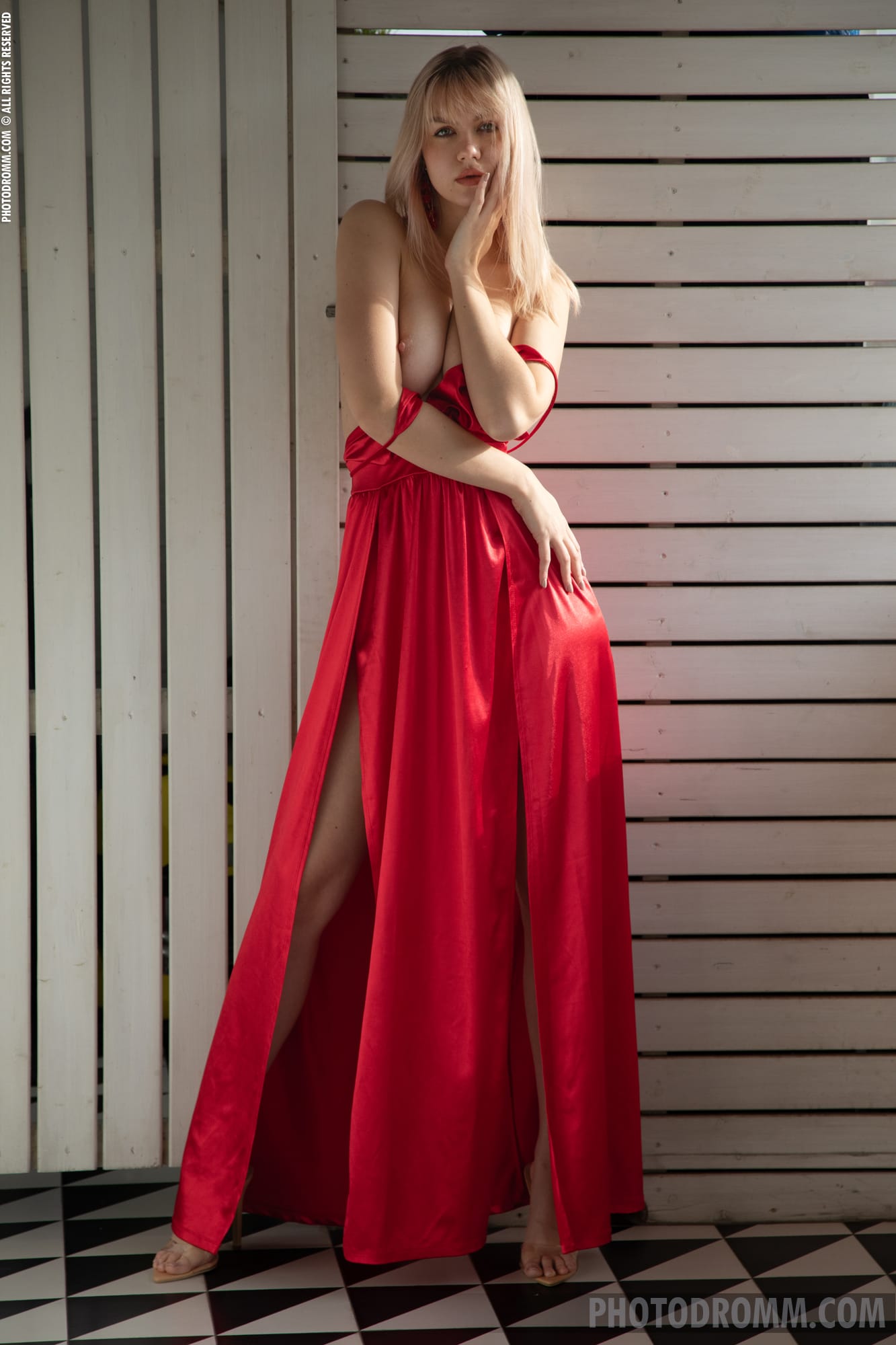 Hot blonde Layanna drops her red dress, pressing her busty figure and big melons