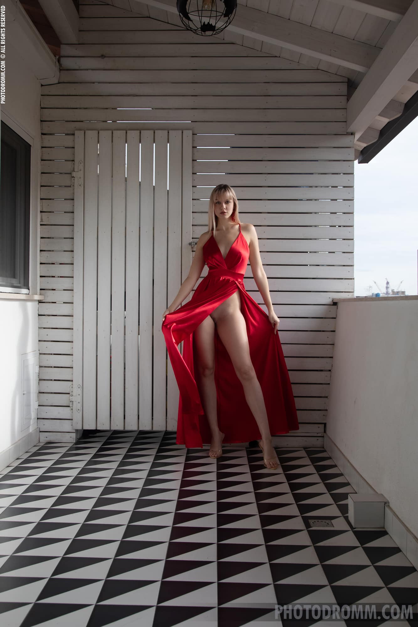 Hot blonde Layanna drops her red dress, pressing her busty figure and big melons
