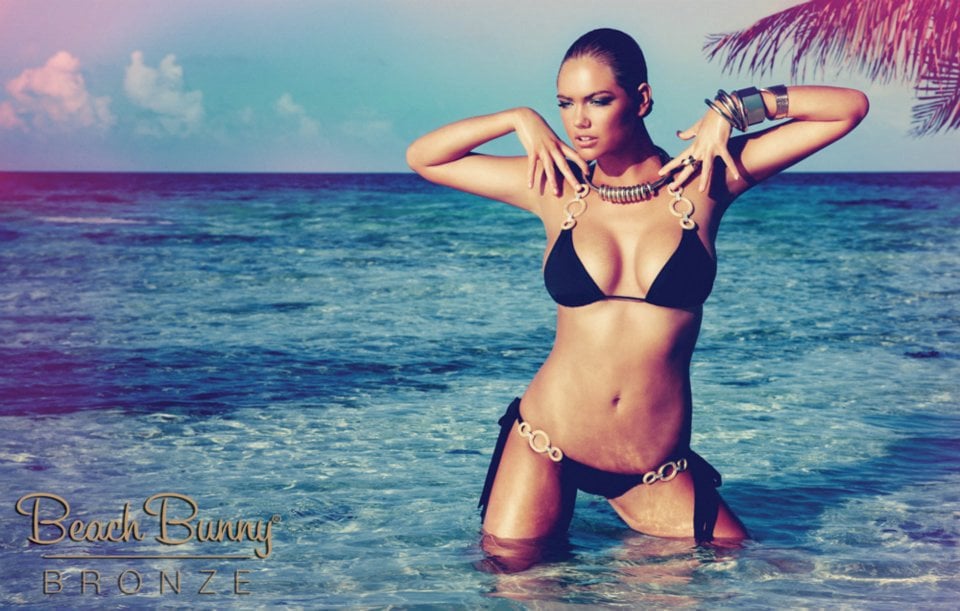 Kate Upton posing in bikini on the beach