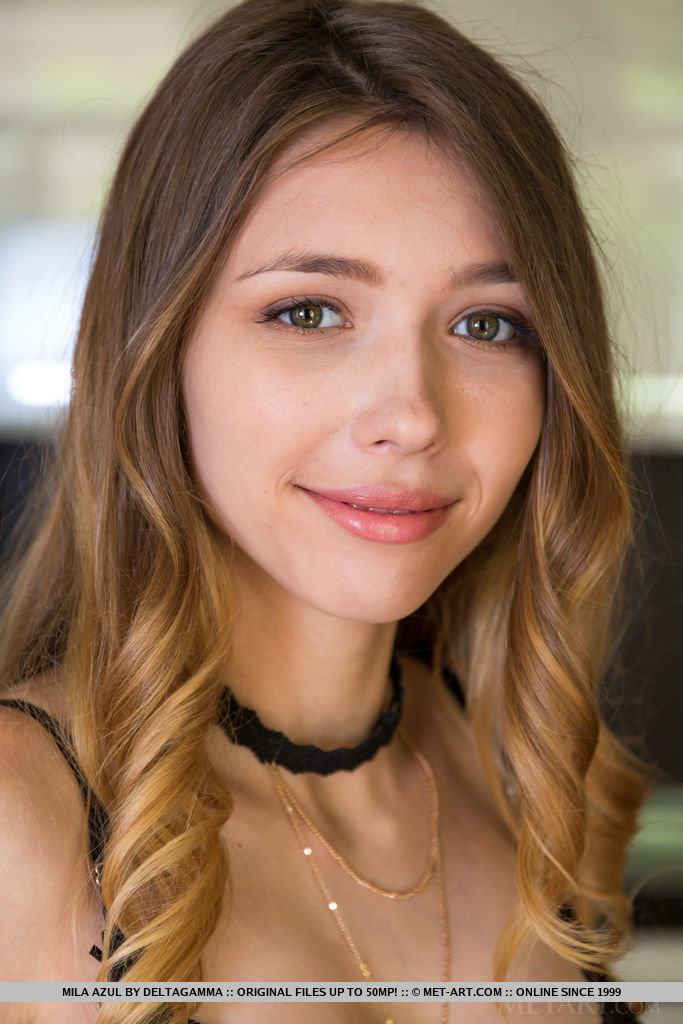 Mila Azul takes off her black lingerie bodysuit on the sofa