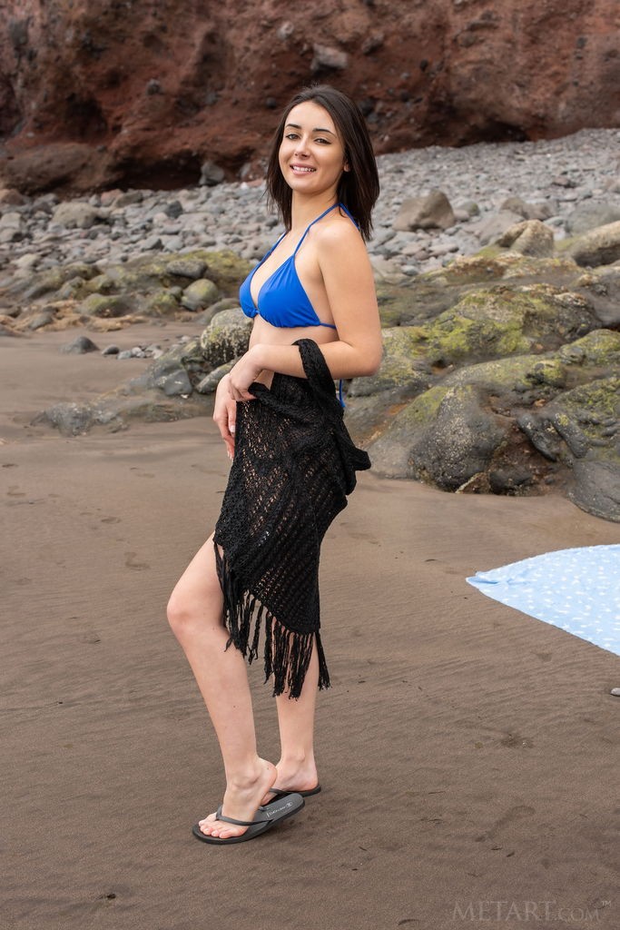 Dionisia - Beautiful beach bum suns her bare bum at the beach
