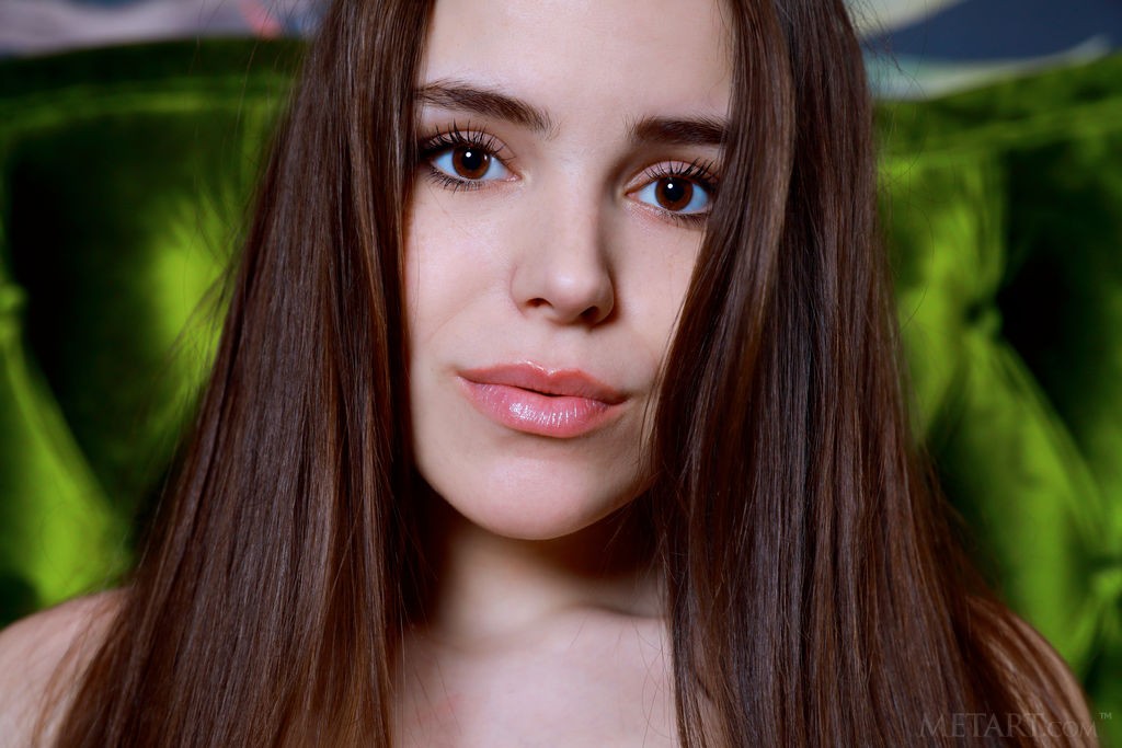 Eva Amari - Amazing girl on a big green sofa enjoying herslef