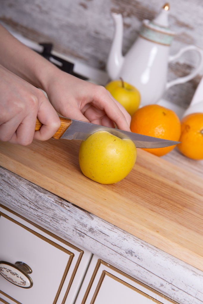 Renzi - Redhead babe cuts up fruit and strips along the way