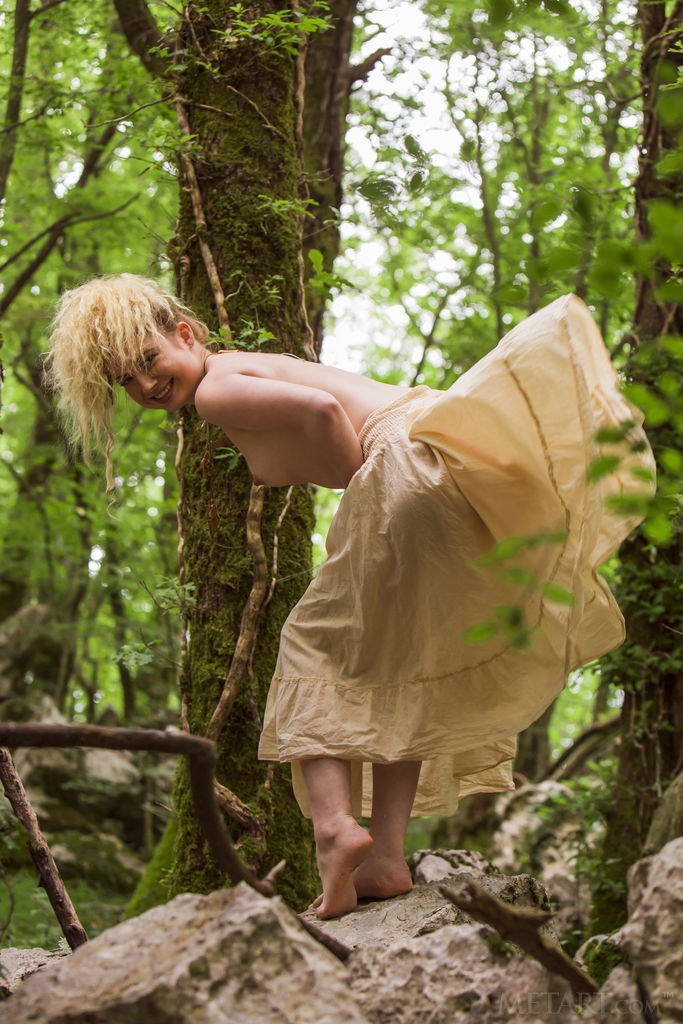 Taylor - Sexy, curly haired blonde has fun getting naked in nature