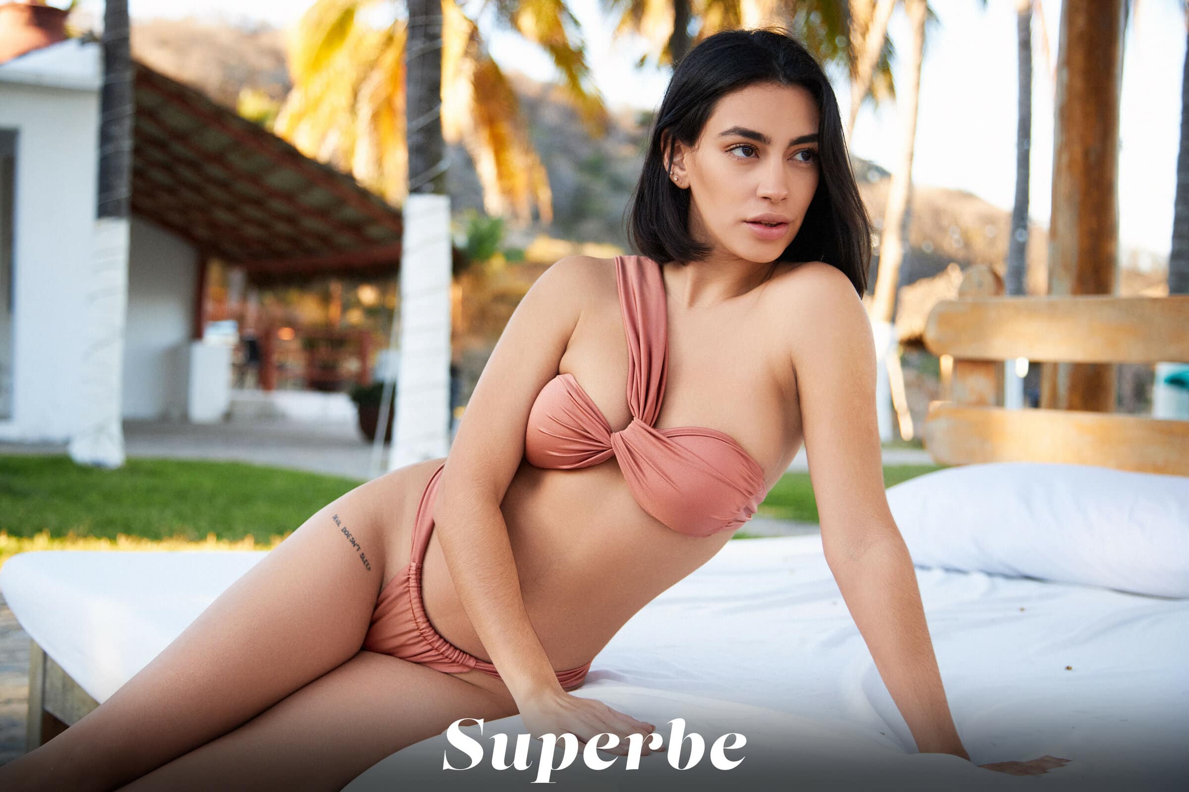 Watch Danny Hernandez naked, displaying her curvy body as she poses on the beach