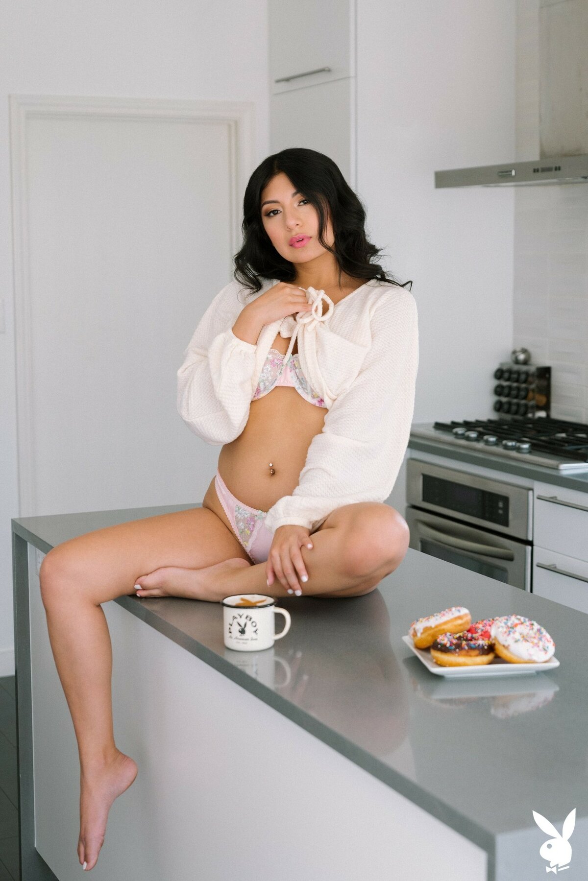 Cami Strella undresses in the kitchen and reveals her large bum on the countertop